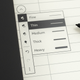 A close-up of the on-screen stroke settings for the Kindle Scribe's stylus, sitting on a wooden desk.